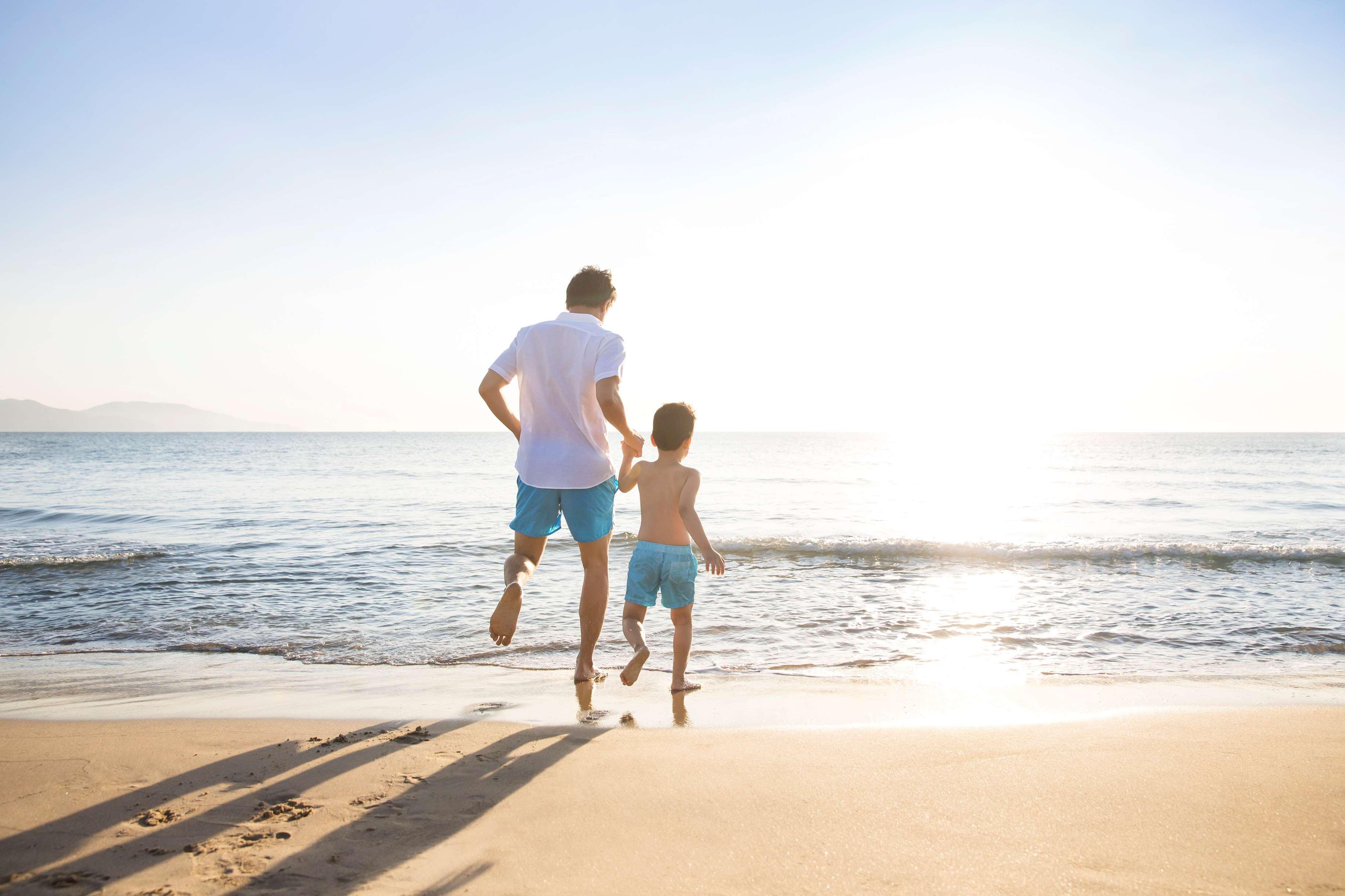 Hyatt Regency Danang Resort And Spa Bagian luar foto A father and son on a beach